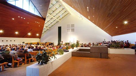 Votive candles with holy family statue. JLG Architects - Holy Family Church