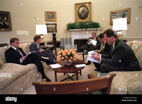 In The Oval Office Of The White House President George W Bush Sits