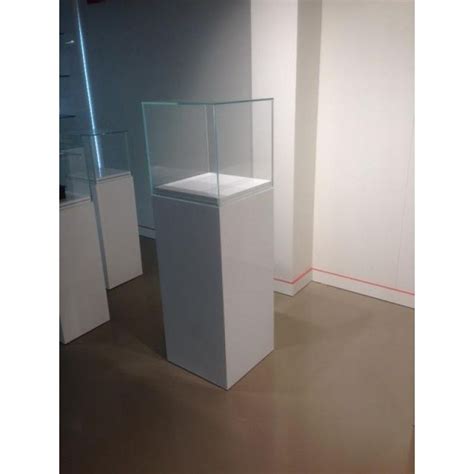 A podium (plural podiums or podia) is a platform used to raise something to a short distance above its surroundings. Vitrine podium en verre