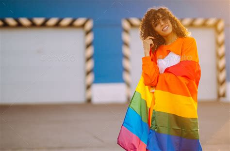african american lesbian woman holding lgbt rainbow flag concept freedom love for same sex