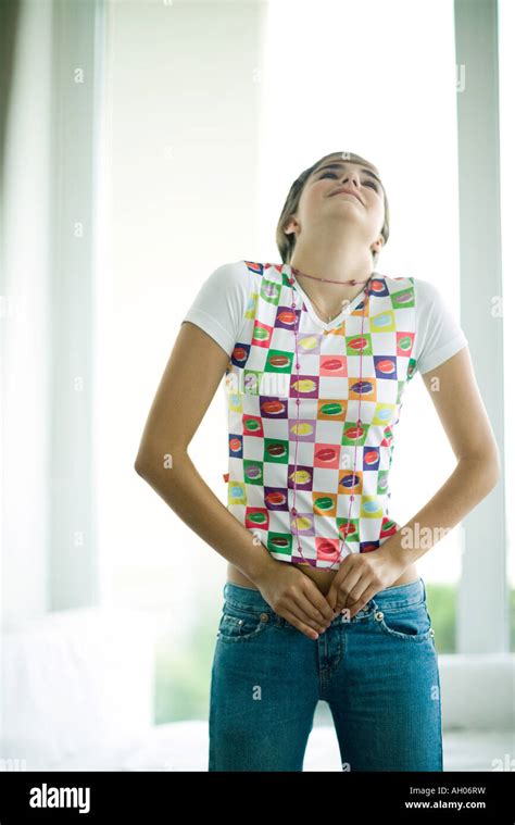 Teen Girl Trying To Button Jeans Stock Photo Alamy