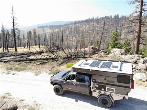 Four Wheel Camper on a Tundra Smooth Side Flatbed with Dual Solar