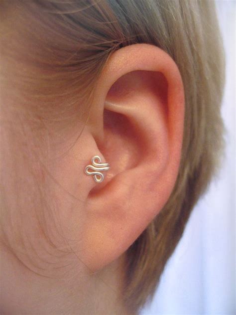 Our piercings are safe, simple and gentle. The Fleur LeftEar Tragus Cuff Silver Ear Cuff wire by ZyDesigns, $12.00 | Diy earrings cuff, Diy ...