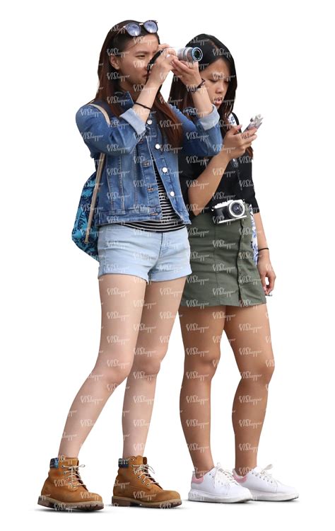 two teenage asian girls standing and taking a picture - VIShopper