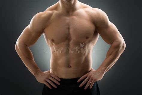 muscular man standing with hands on hip stock image image of strength standing 74154333