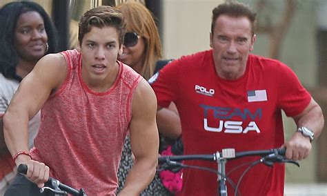 I told you i'd be back. Arnold Schwarzenegger and son Joseph Baena take a bike ...