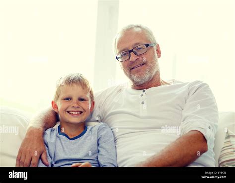 Smiling Grandfather And Grandson At Home Stock Photo Alamy