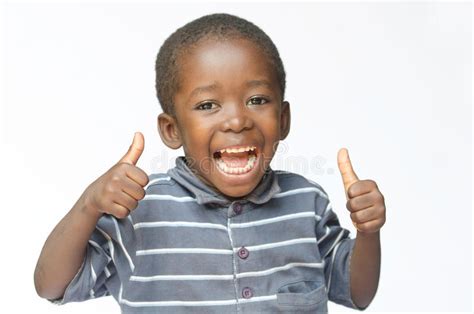 Very Happy African Black Boy Making Thumbs Up Sign With Hands Laughing