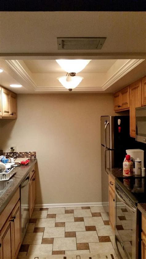 Back in the day, many homes were built with a similar kitchen lighting. Picture only | CEILING LIGHTS Replacing recessed fluorescent lights | Pinterest