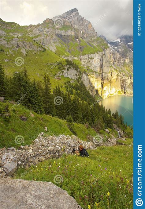 Mountain Landscape With A Lake Of Oeschinensee With A Photograph