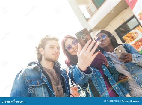 Multiracial Friends Taking Selfie Outdoors Stock Image Image Of Friendship Jeans 145227755