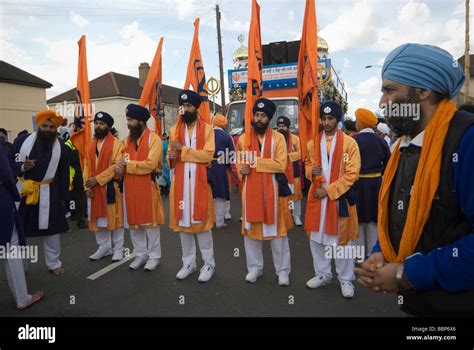 Sikhs Carrying Flags With The Sikh Khanda Symbol In Hounslow At The