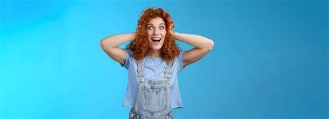 Premium Photo Excited Amused Joyful Redhead Curly Girl Having Amazing Perfect News Touch Hair