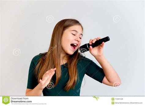 Girl Singing With A Microphone Stock Photo - Image of ...
