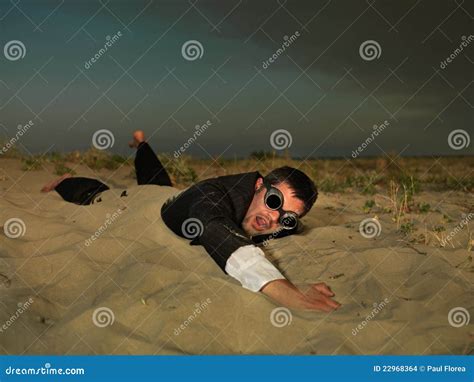 Young Businessman Swimming Through Sand In Suit Stock Images Image