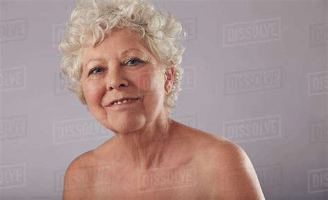 Portrait Of Beautiful Naked Senior Woman Looking Happy
