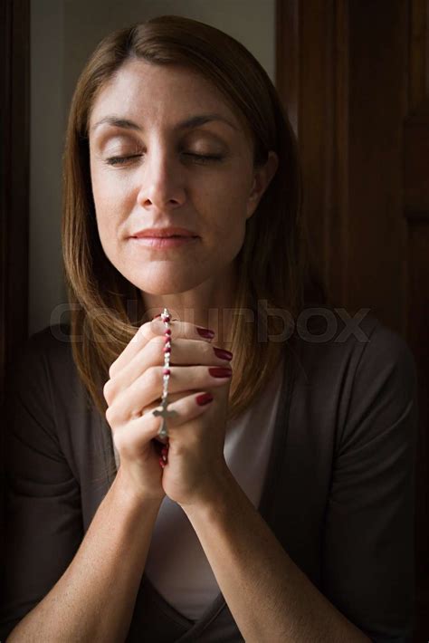 Woman Praying With Rosary Stock Image Colourbox