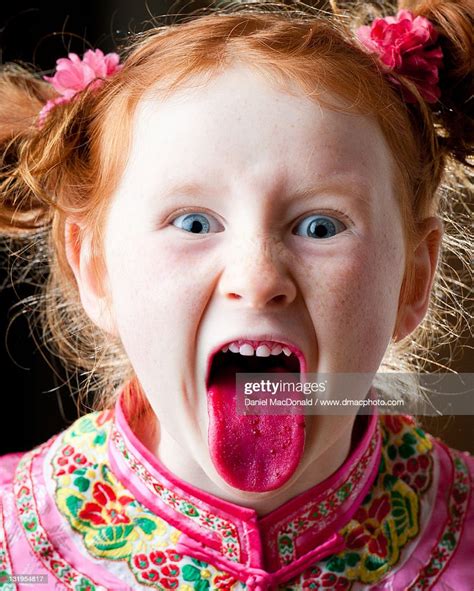 Wild Redheaded Girl With Beetstained Tongue Photo Getty Images
