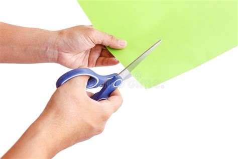 Hand Using Scissors Cuting Green Paper Isolated On White Stock Photo
