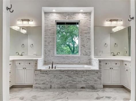 Do you backsplash wall to wall or ceiling? Love this tile backsplash around the tub...really frames ...