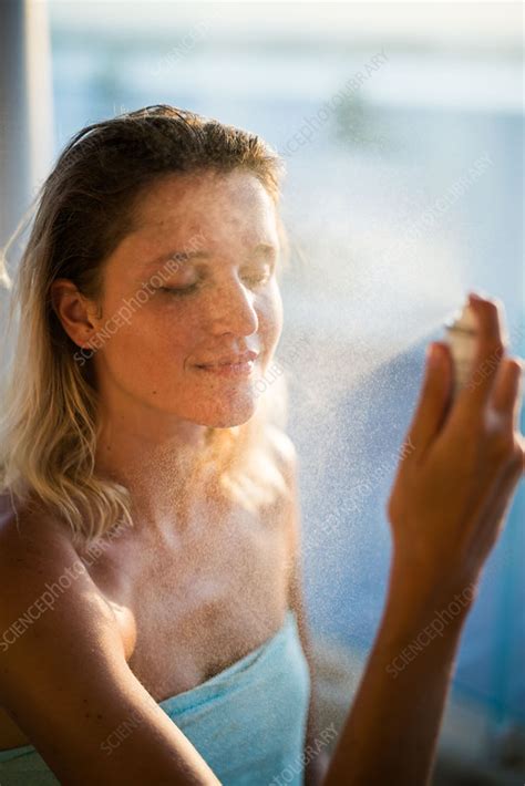 Woman Spraying Water On Her Face Stock Image C035 4031 Science Photo Library