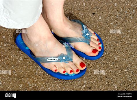Red Painted Toenails And Flip Flops Stock Photo Royalty Free Image