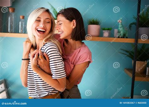 Cheerful Lesbians Embrace Passioantely And Have Fun Together Stock