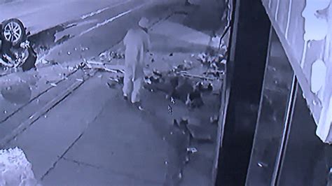 Surveillance Footage Shows Man Help Crash Victim