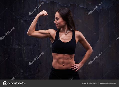 Effective Bicep Workout Of Slim Female Isolated Over Black Backg Stock