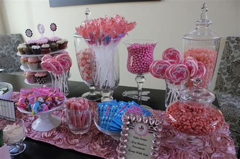Pink Candy Buffet In Apothecary Jars Sets The Decor For A Sip And See