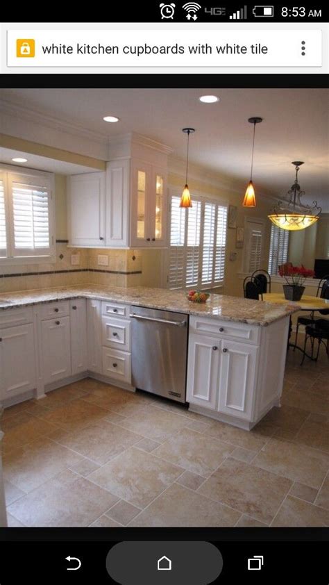Kitchen with light wood flooring. Love the sure cupboards with tan counter | Beige kitchen ...
