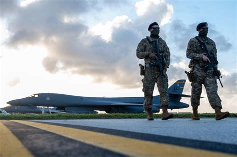 Security Forces Airmen patrol near B-1B at Andersen Air Force Base