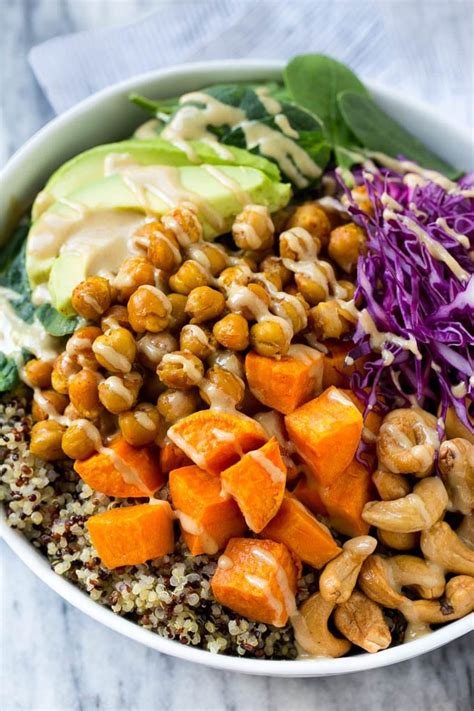 A Buddha Bowl Filled With Quinoa Sweet Potatoes Chickpeas And Avocado