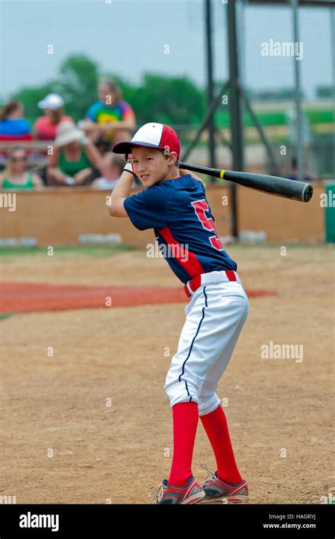 Youth Little League Baseball Boy Getting Ready To Bat Stock Photo