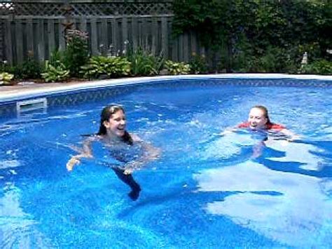 Petite stepsister having fun in the pool and masturbates. Swimming with Clothes on - YouTube