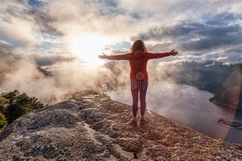 Adventurous Girl Hiking On Top Of A Peak Stock Image Image Of Clouds