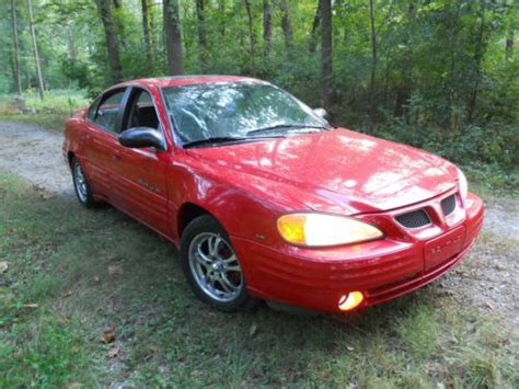 Someone brought me this car to fix, she was told water pump and has already purchased a new one. Buy used 1999 Pontiac Grand Am - Bright Red - Rebuilt Top ...