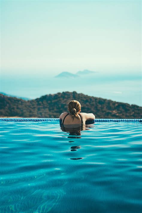 Woman In Infinity Pool Photo Free Water Image On Unsplash