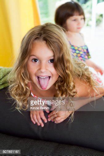 Portrait Of Confident Girl Sticking Her Tongue Out Photo Getty Images