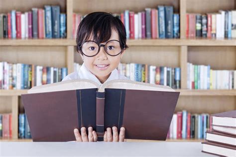 Child Learns And Reads Science Books Stock Photo Image Of Attractive