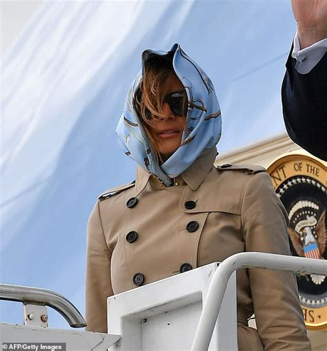melania trump struggles to keep her headscarf in place on a very windy runway in ireland daily