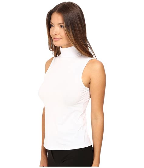 theory synthetic wendel ribbed viscose sleeveless turtleneck top in white lyst