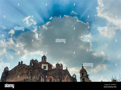 Catholic Church In Mexico And Dramatic Sky With Clouds And Rays Stock