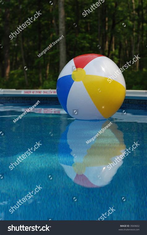 Colorful Beach Ball Floating In A Pool Stock Photo 3569602 Shutterstock
