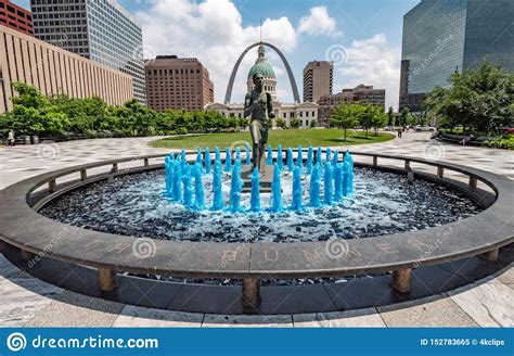Blue Water Fountain With Runner Statue At Kiener Plaza Park In St