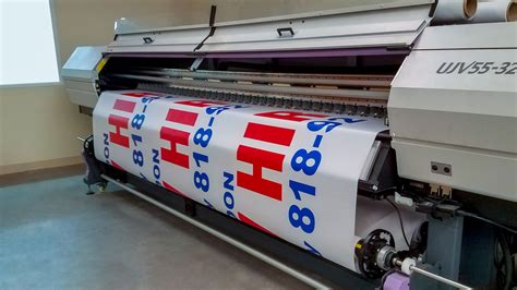 Printing Process Of A Large Advertising Banner Front Signs