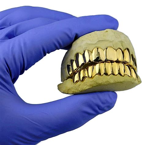Maybe you would like to learn more about one of these? Real 14k Solid Gold Teeth Gold Tooth Custom Grillz