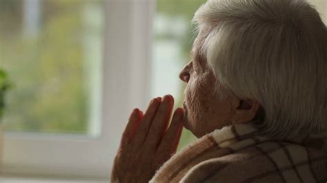 Old Woman Praying In A Fron Of Window Stock Video Footage 0015 Sbv