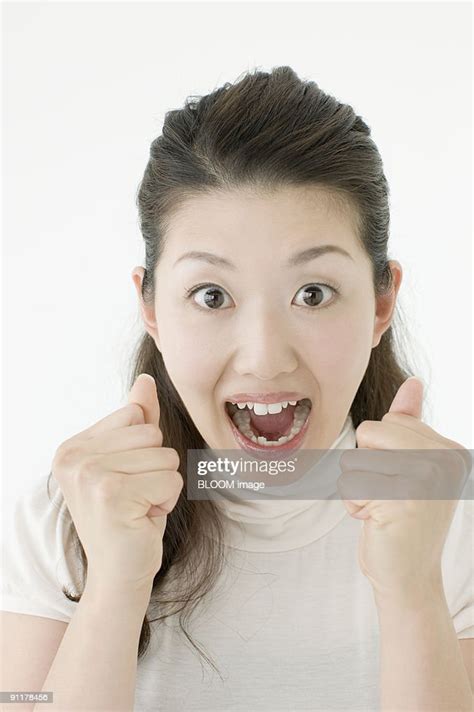 Woman Clenching Fists With Mouth Wide Open Portrait Studio Shot High