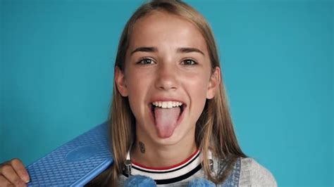 The Teenage Girl Shows A Tongue And Laughs Stock Footage Videohive